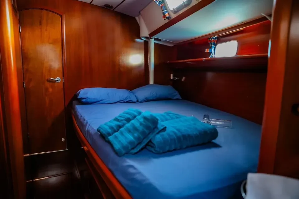 Double cabin with blue bedding on the Beneteau 50