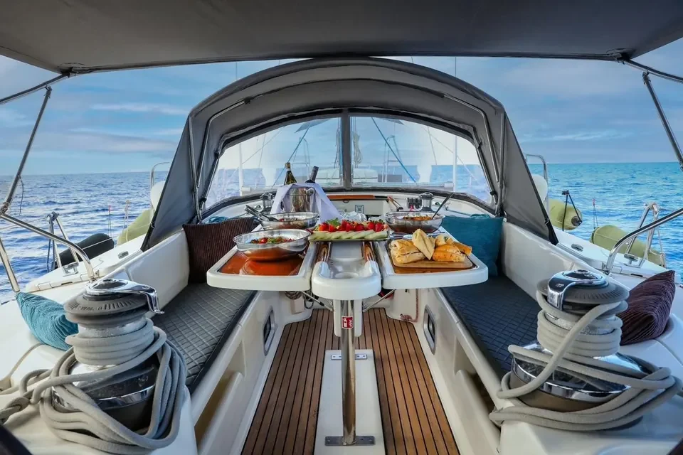 Cockpit table set with food on the Beneteau 50