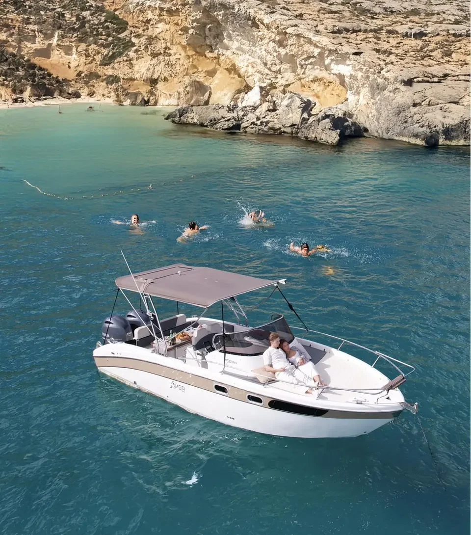 Aerial view of the Saver 750 WA anchored with guests swimming